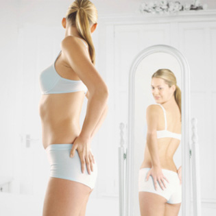 woman-looking-at-self-in-body-mirror-article